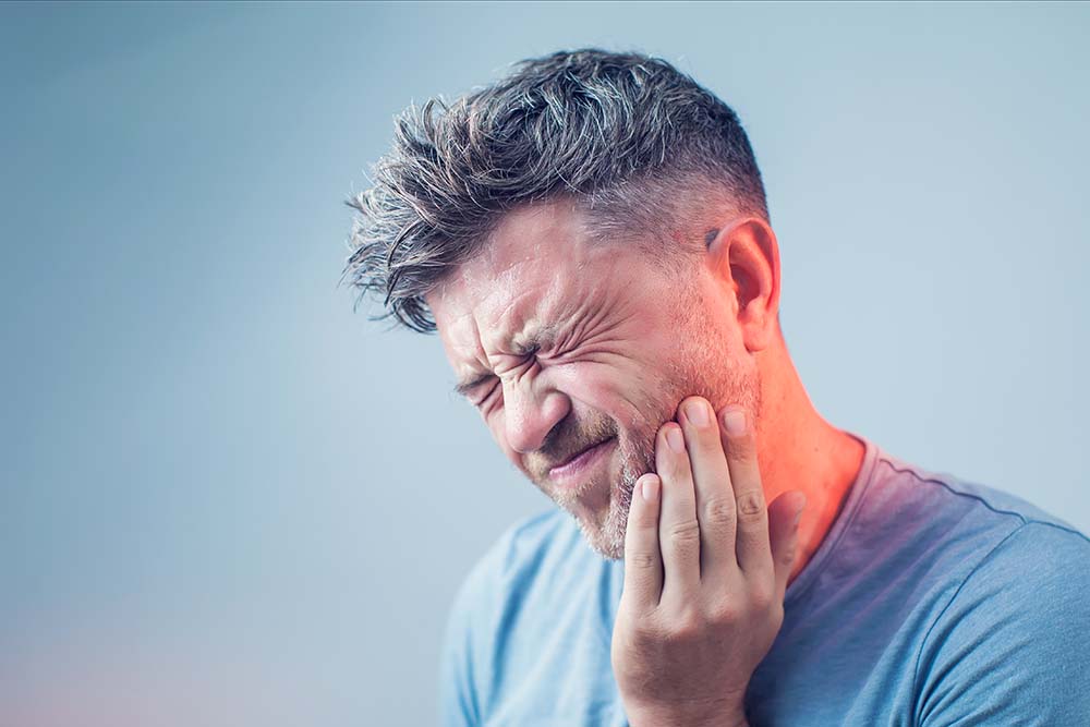 man with tooth pain dental emergency