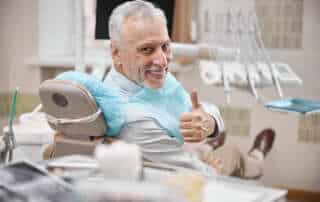 senior man with dental implants